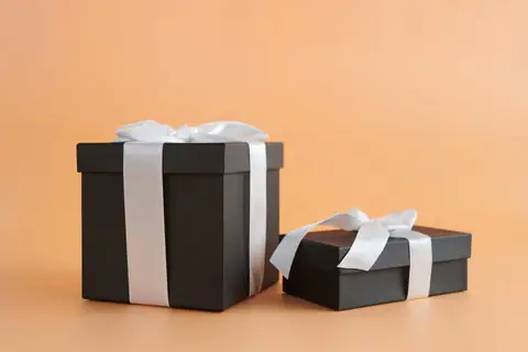 Black gift boxes with white ribbon