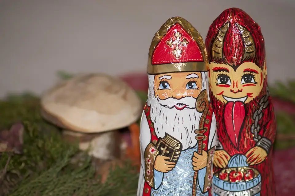 Foil-wrapped chocolate figures of St. Nicholas and Krampus side by side