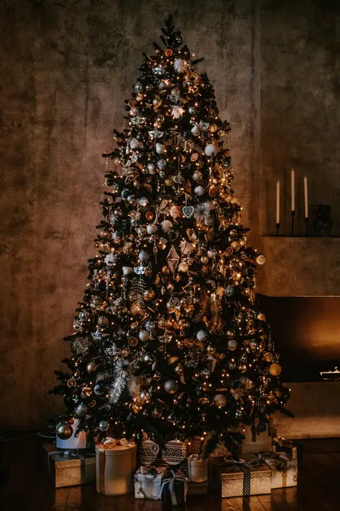 Dark Christmas tree with gold ornaments