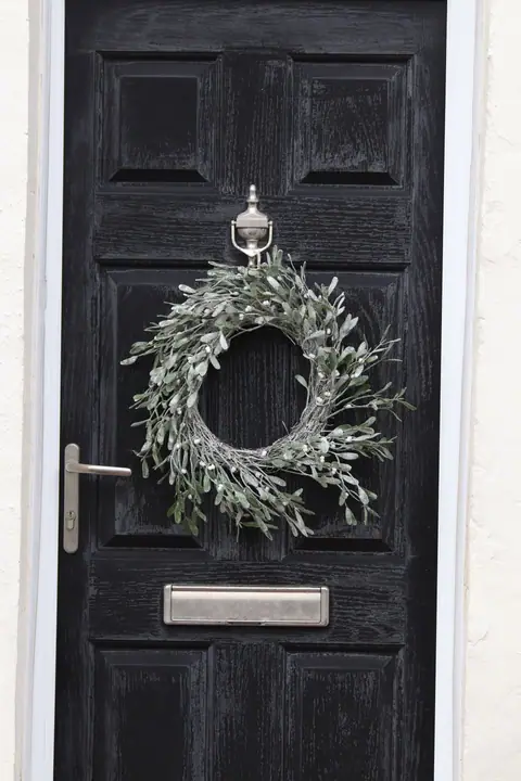 Winter wreath on a black door